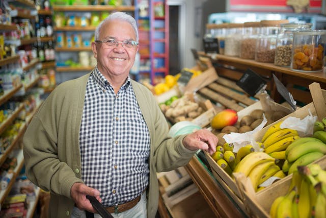 elderly man shopping in supermarket