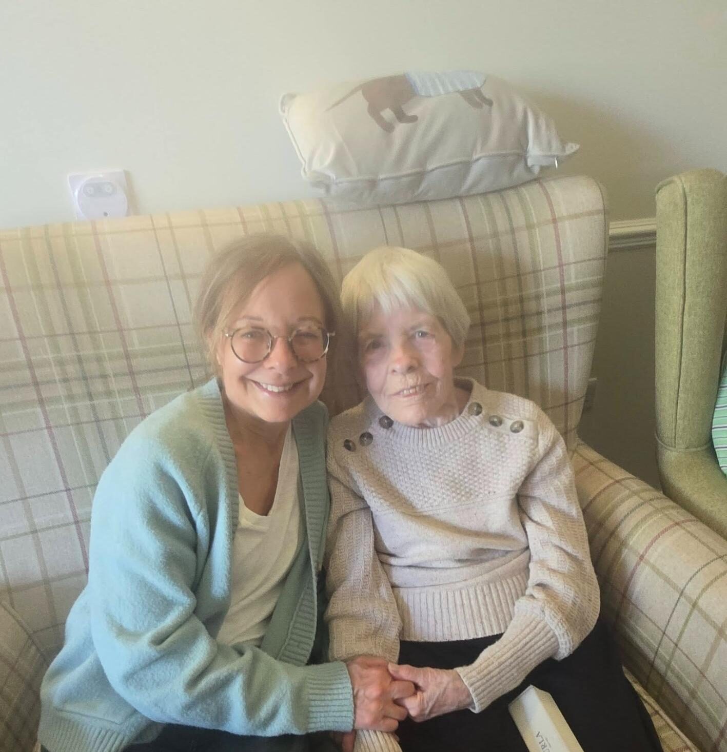 two elderly women smiling together